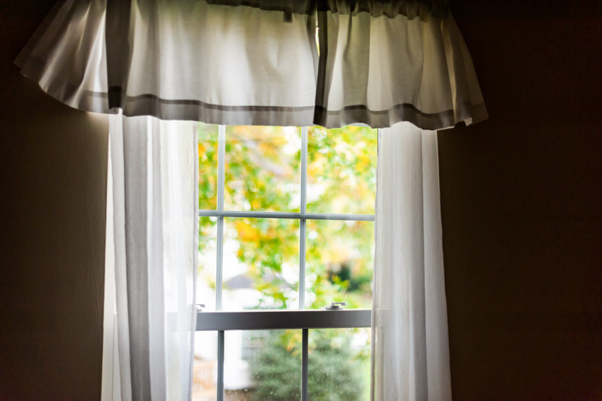House window with tier curtain