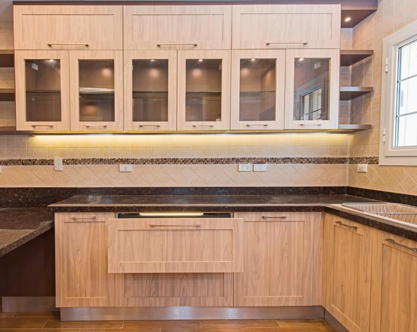 Interior design decor showing wooden kitchen with cerused kitchen cabinets and granite countertop