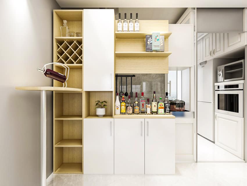 Kitchen with built-in dry bar, wood cabinets, and wine holders