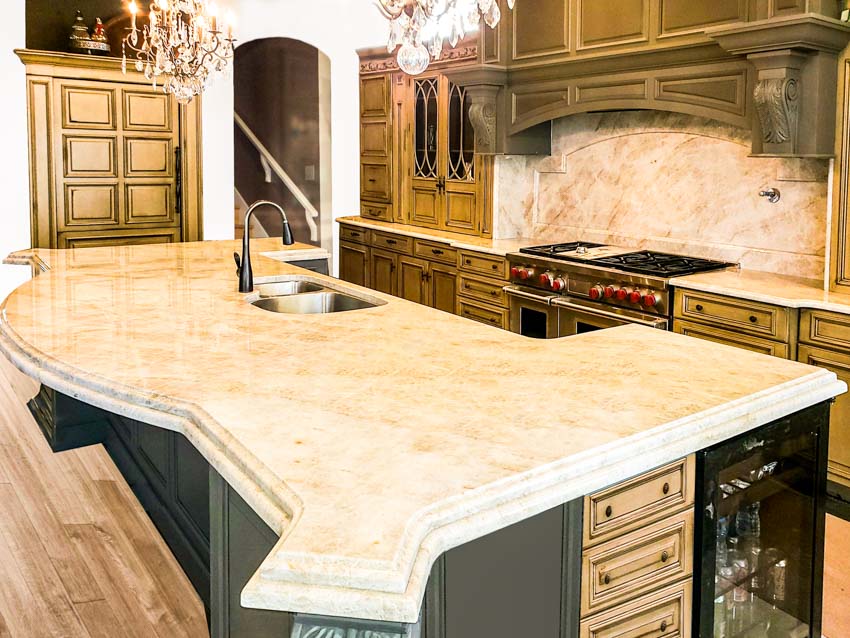 Kitchen with center island, countertop, sink and faucet