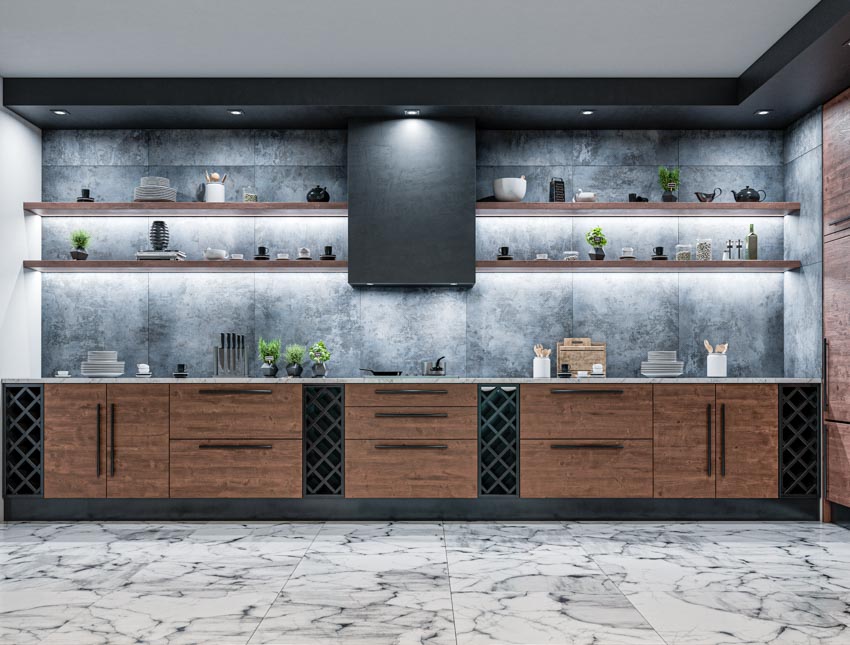 Kitchen with concrete backsplash, wood cabinets, granite countertop, floating shelves, and range hood