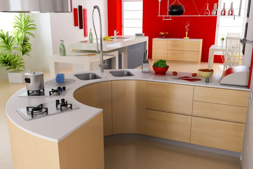 Kitchen with red backsplash, curved solid surface countertop and dual sink