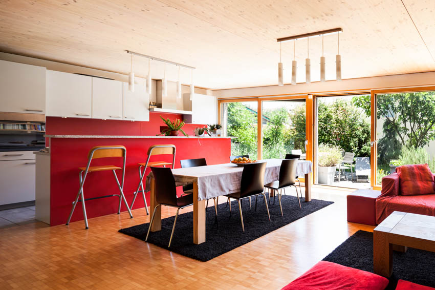 Kitchen with hanging pendant lights, and picture windows