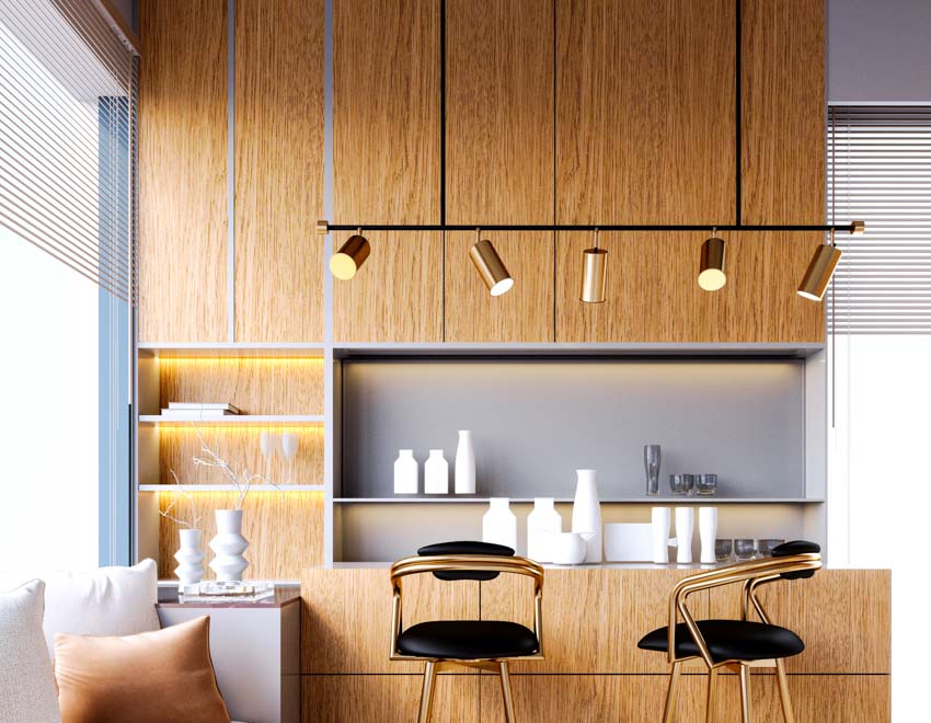 Kitchen with stained cabinets, bar counter, shelves, pendant lights, window, and bar stools