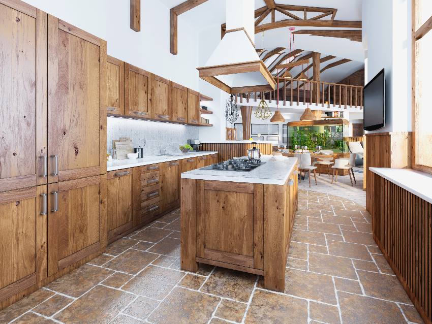 Large kitchen with wooden furniture, island with white worktops and stained hickory cabinets