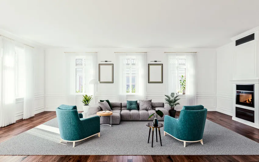 Room with accent chairs, modular sleeper sectional, fireplace, and curtain