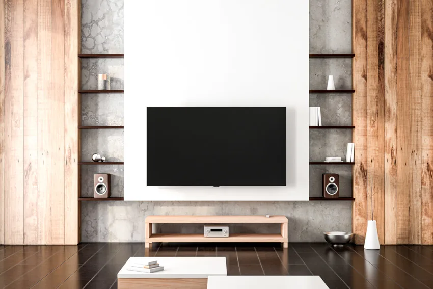 Living room with African Padauk shelves, television and console table