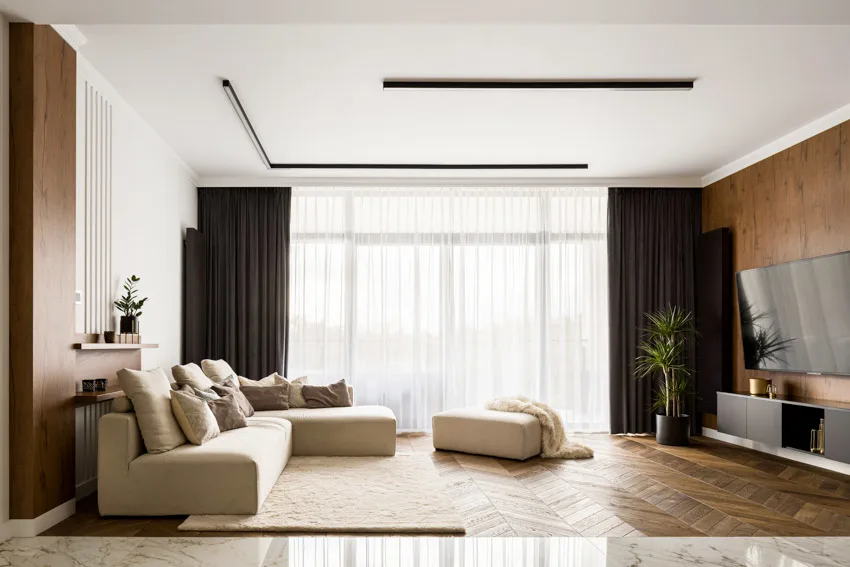 Room with white ceilings, brown walls and dark brown curtains