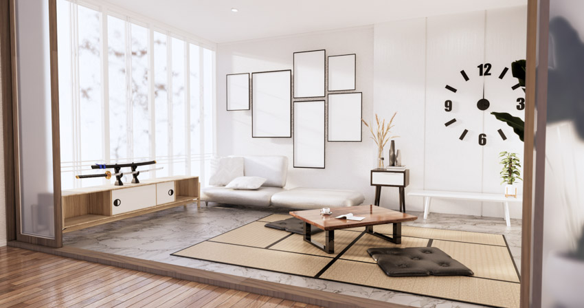 Minimalist living room with tatami mat, console table, windows, wall clock, and curtain
