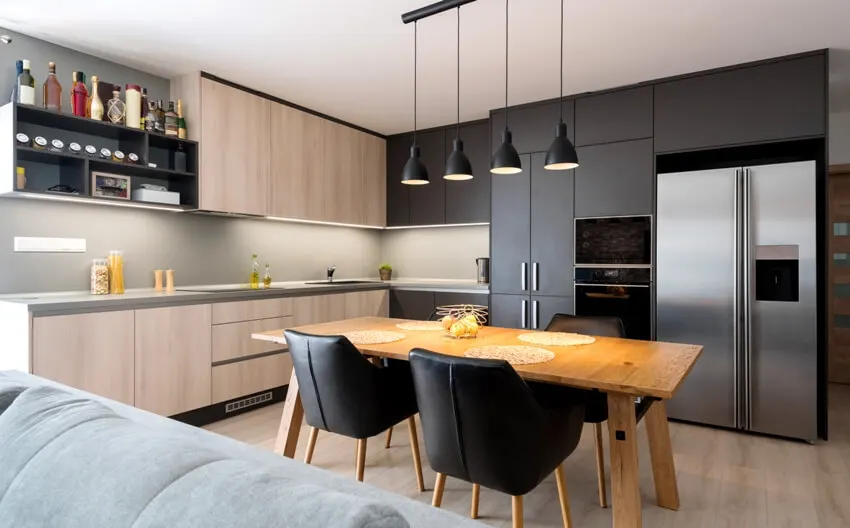 Kitchen with dining set, upholstered chairs, open shelves and black floor to ceiling cabinets