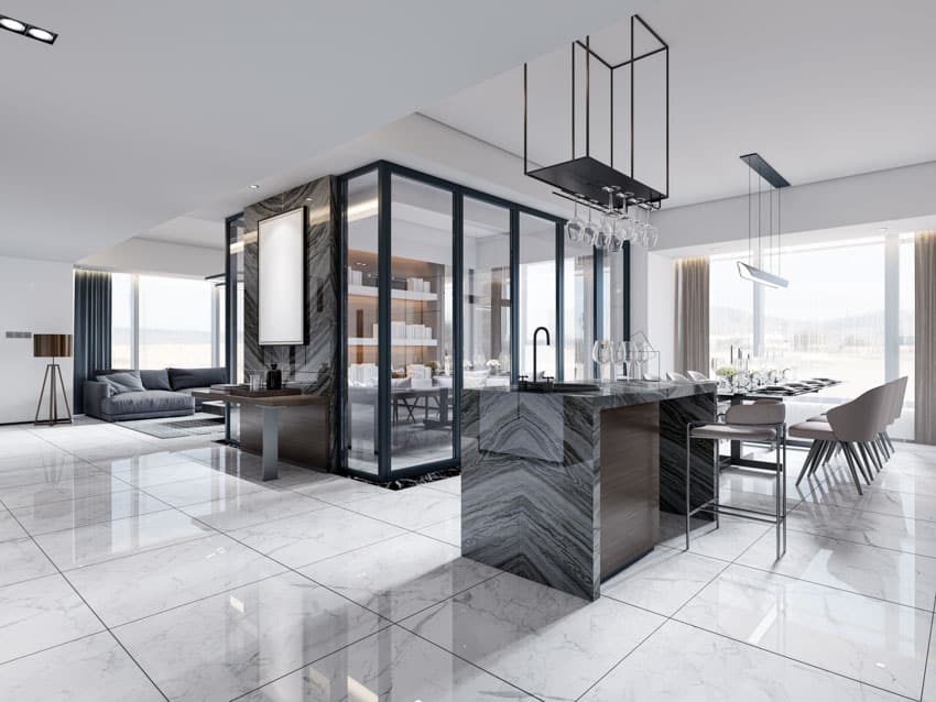 Modern kitchen with gray granite bar, tile floor and glass holders