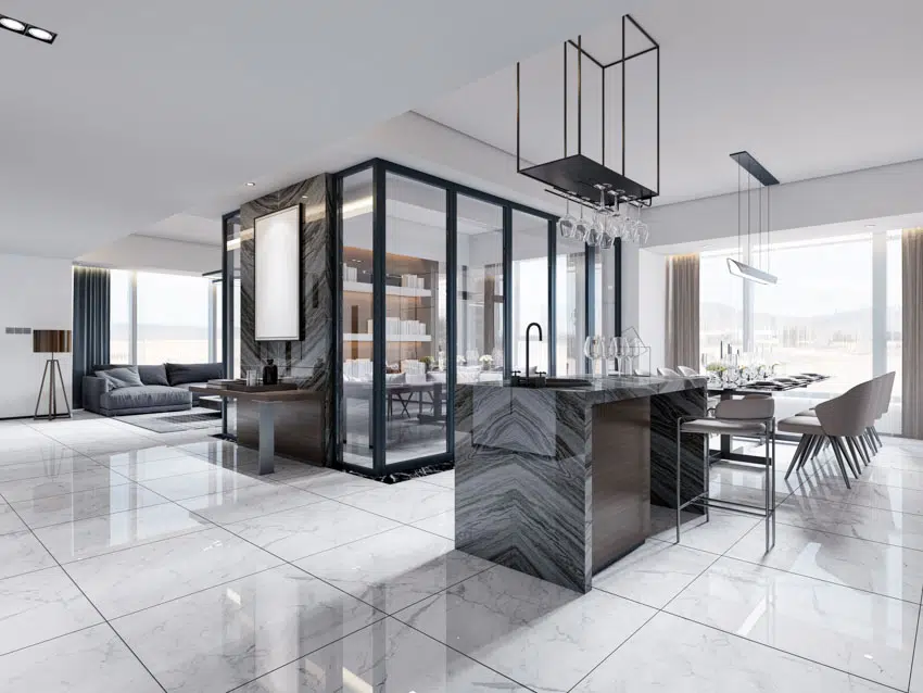 Modern kitchen with gray granite bar, tile floor and glass holders 