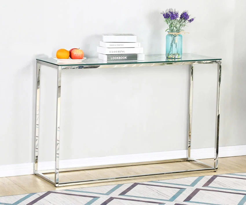 Console table with glass top and metallic finish