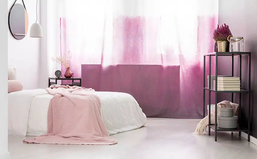 Ombre curtains, pink sheets and white bed