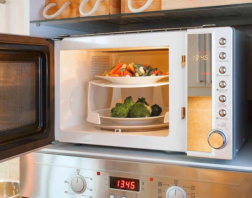 An open microwave types of oven with ceramic plates