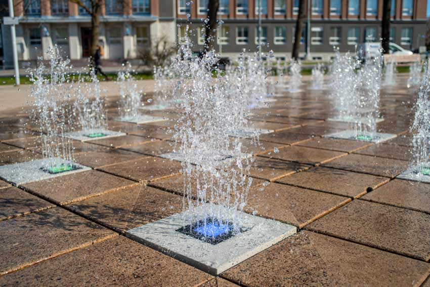 Dry fountain on paved flooring