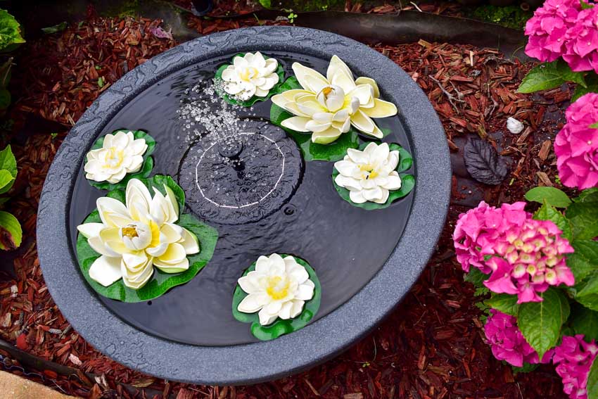 Spouting Japanese type of fountains with flowers