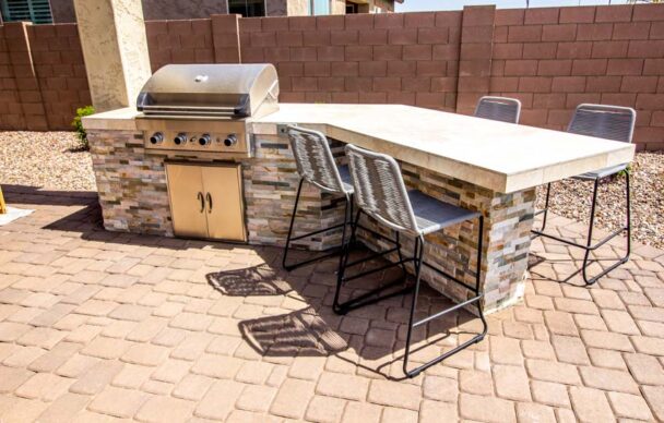 Outdoor Kitchen With Chairs Dining Area Barbecue Grill And Epoxy Countertop Is 608x388 