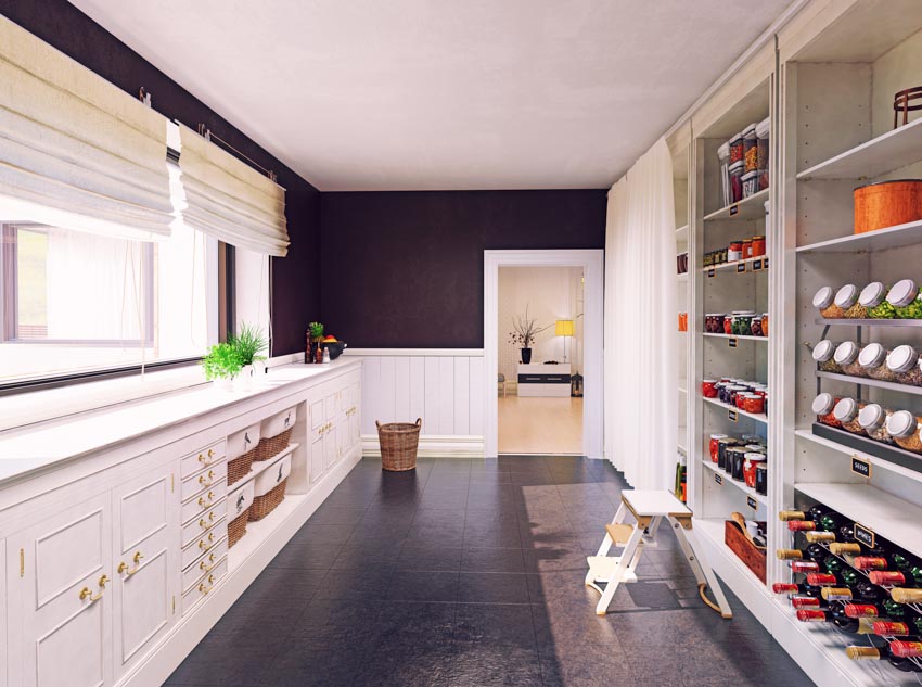 Pantry with shelves, cabinets, drawers, countertop, window, and roman shades