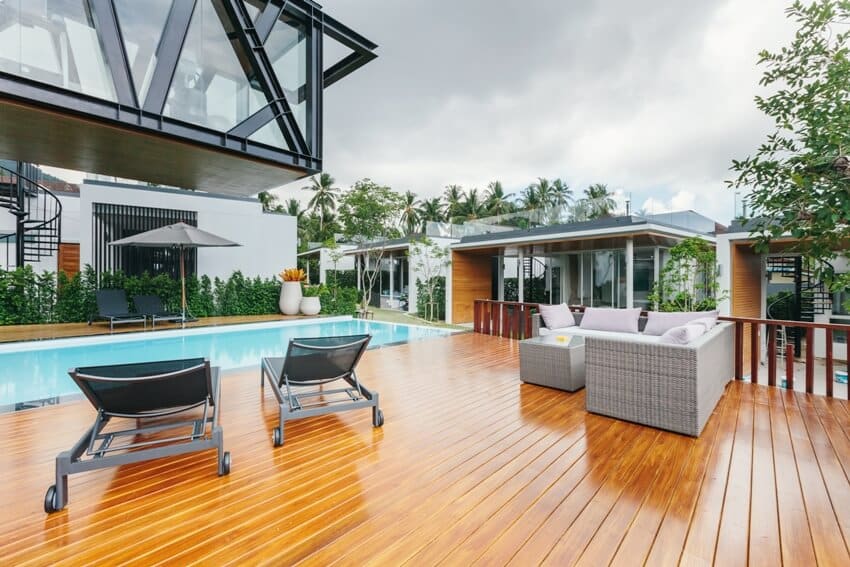 Luxury pool deck with oil based wood stain and outdoor furniture