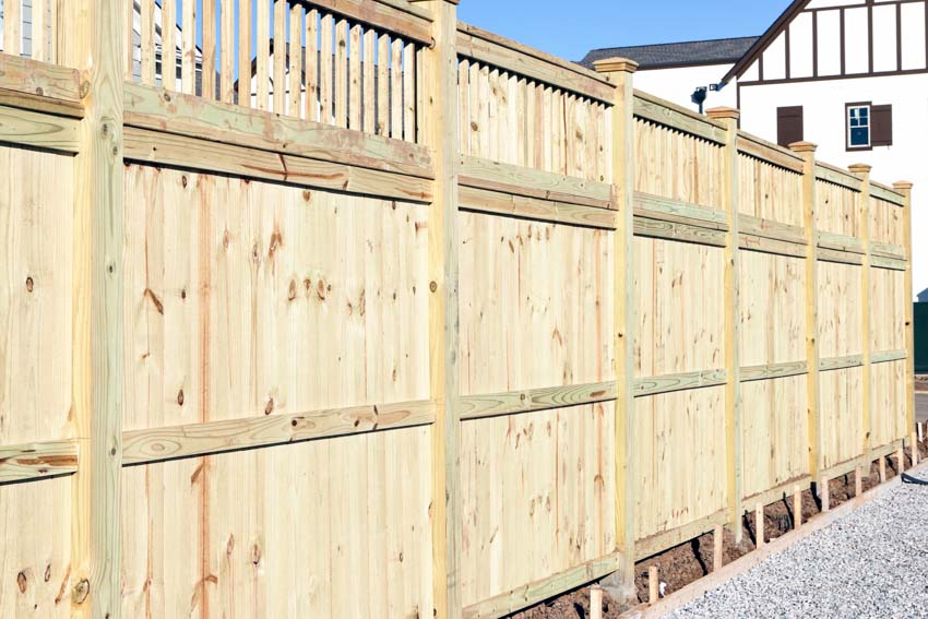 Fence with applied sealing stain