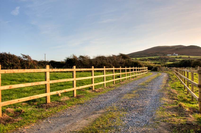 Spacious outdoor area with split rail fences