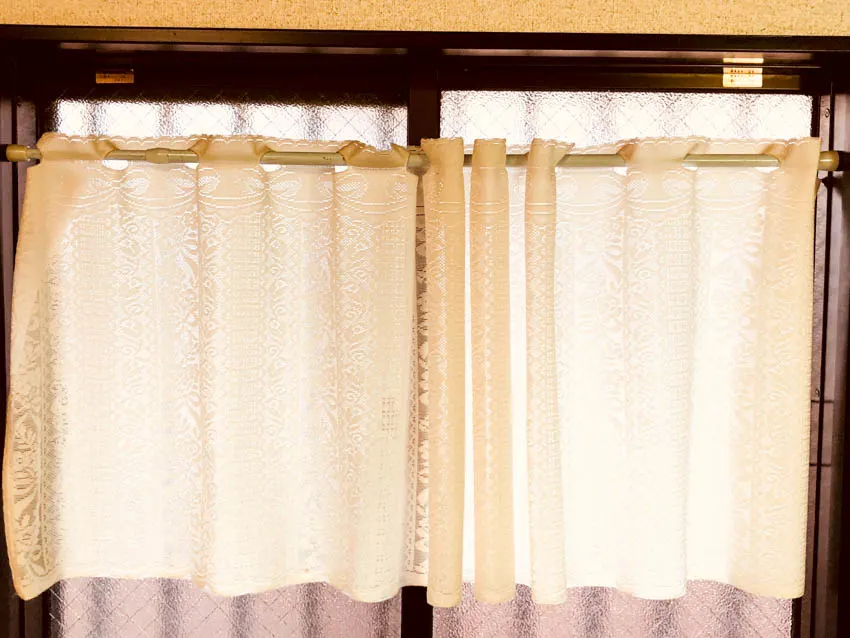 Window with a curtain attached to it