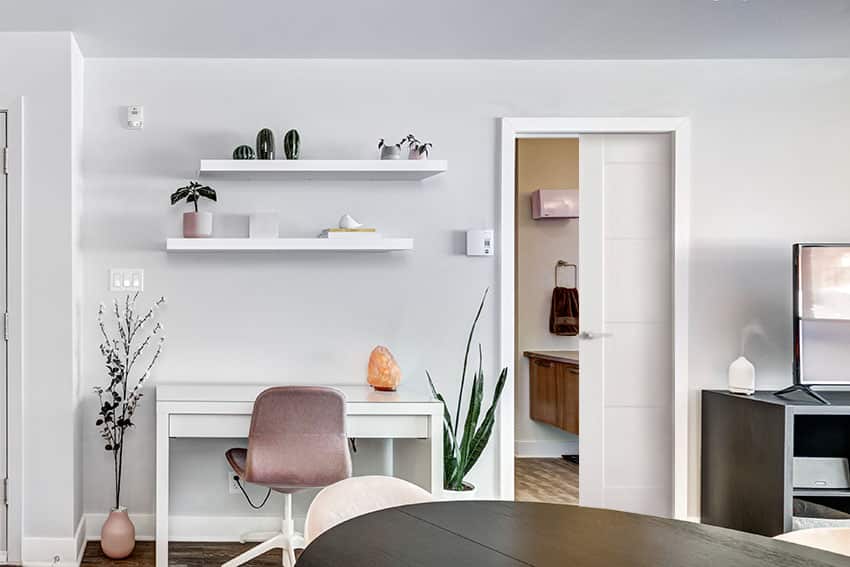 Home office desk with floating shelves gray paint pocket bathroom door