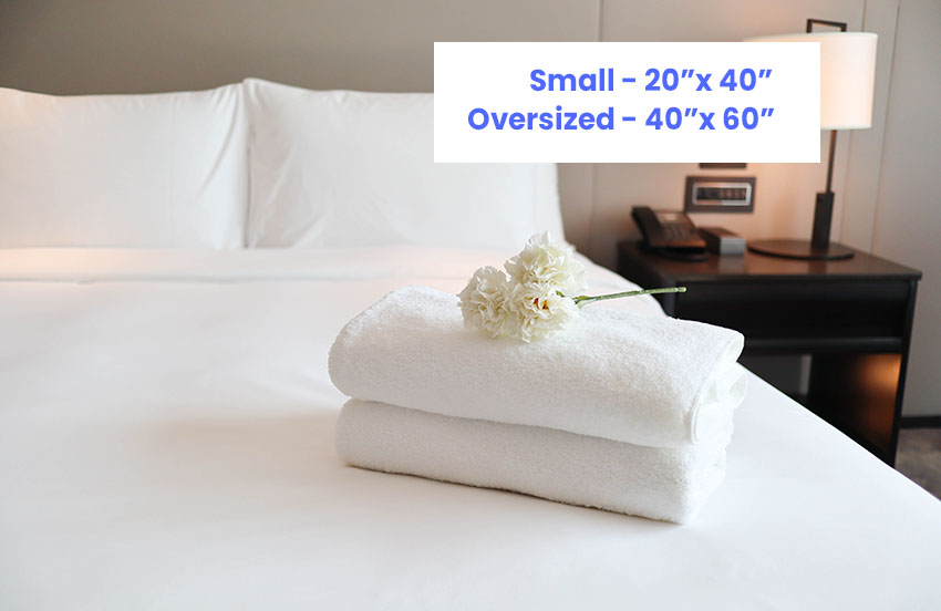 Hotel bed with towel