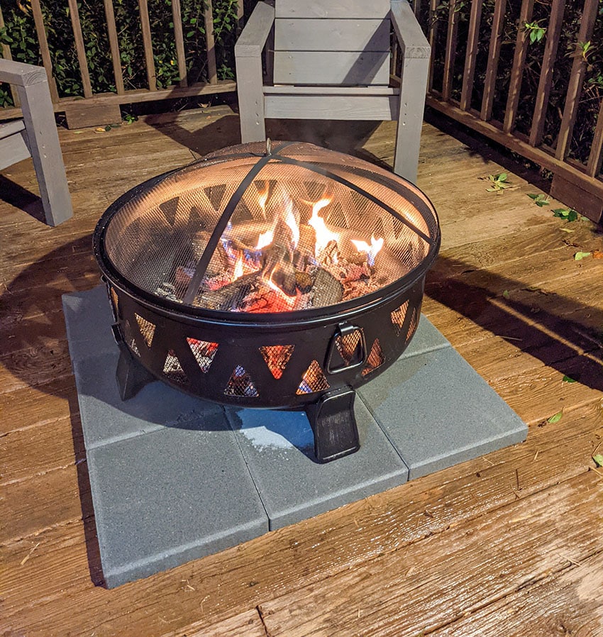 Patio deck fire pit with protective mat