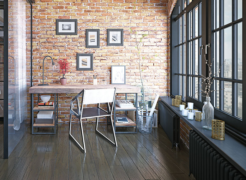Desk with brick wall metal chair wood floor