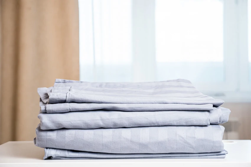 A stack of linen fabric sheets for home use