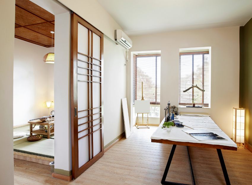 Art room with wooden table, glass windows and sliding shoji door