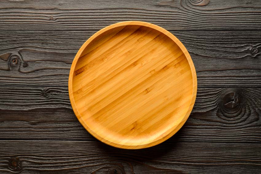 Bamboo plate on top of wood surface