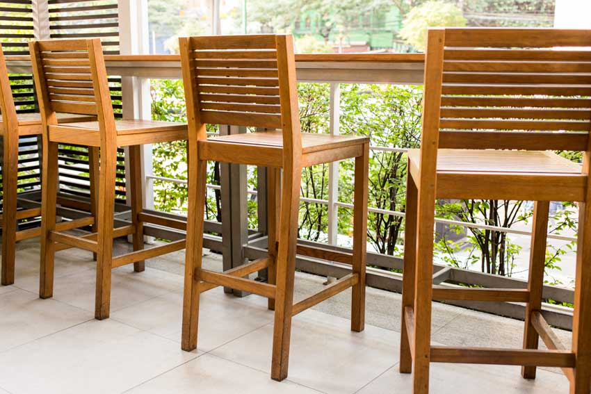 Bar counter by the window with slat back chairs