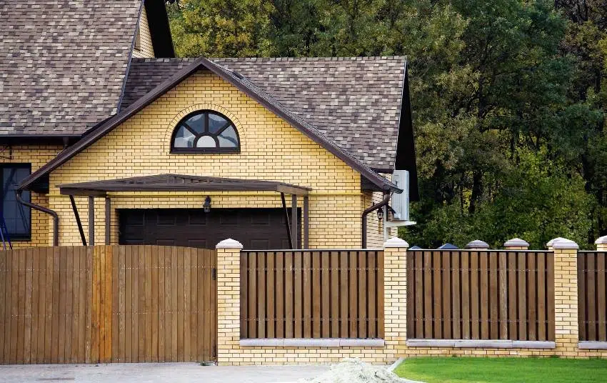 A beautiful brick house with Douglas fir fence