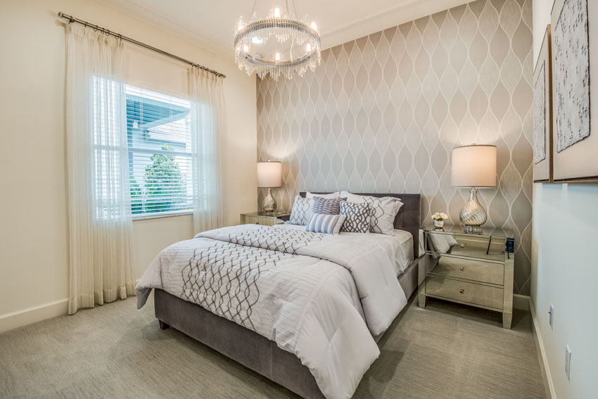 Bedroom with accent wall and curtains