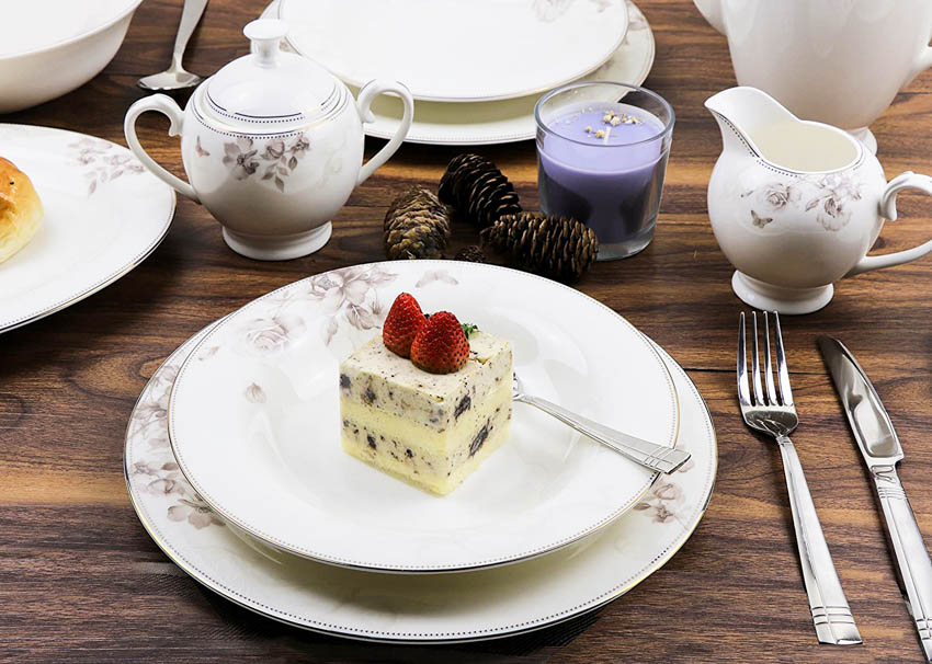 Bone china plate with knife, fork, and tea set