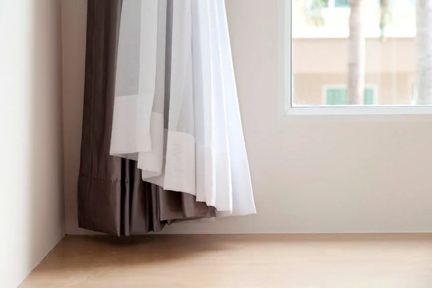 Brown and white reversible curtain joining together