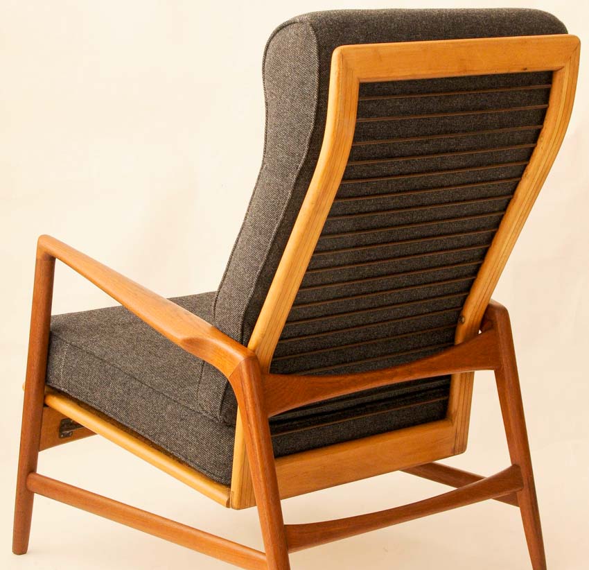Cushioned wingback chair with ladder back design