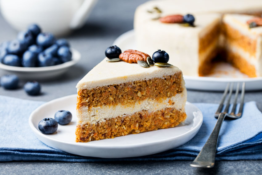 Dessert plate with carrot cake and a fork