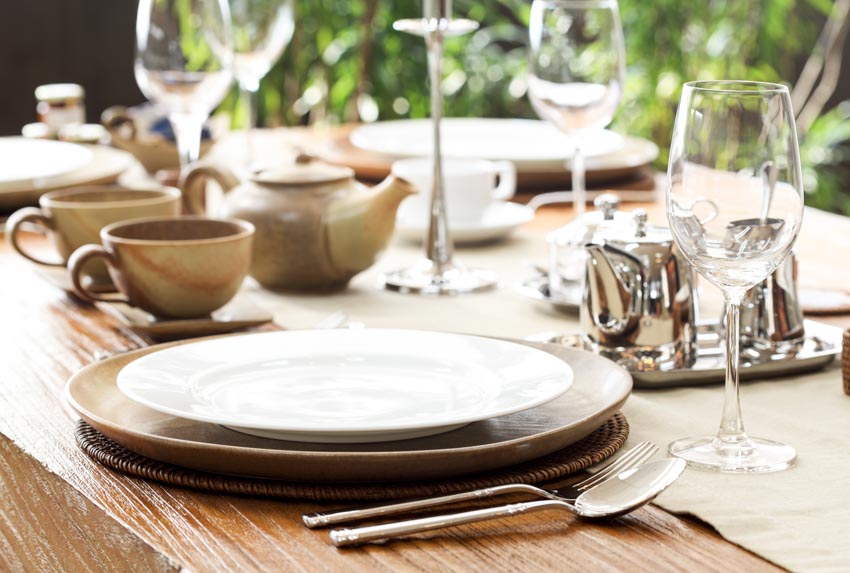 Different types of plates on a wooden table