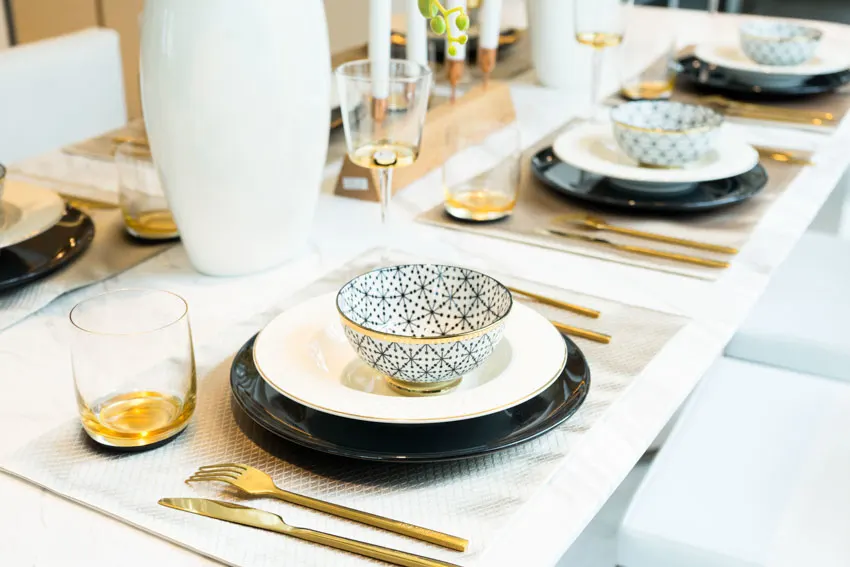 Black, white and gold table plate setting color combination
