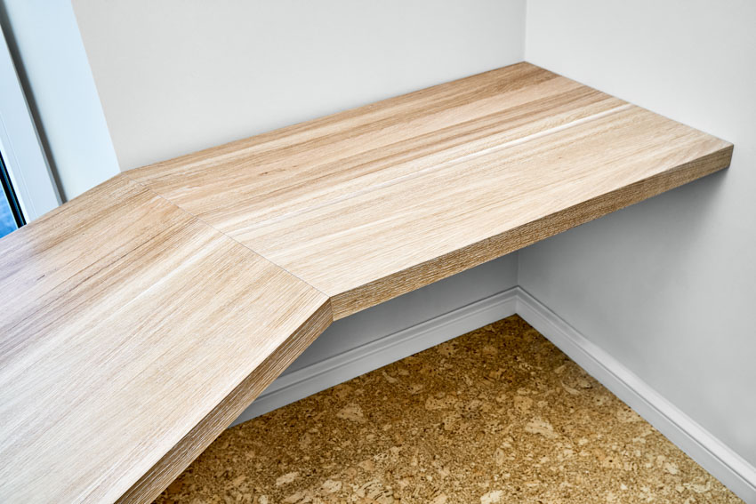 Custom built-in wood table and white walls