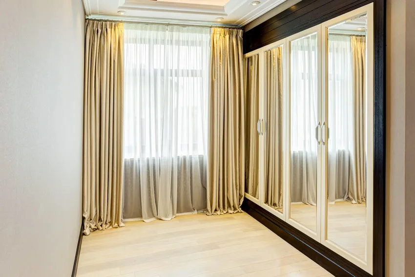 Glass mirror cabinet, and floor to ceiling shades