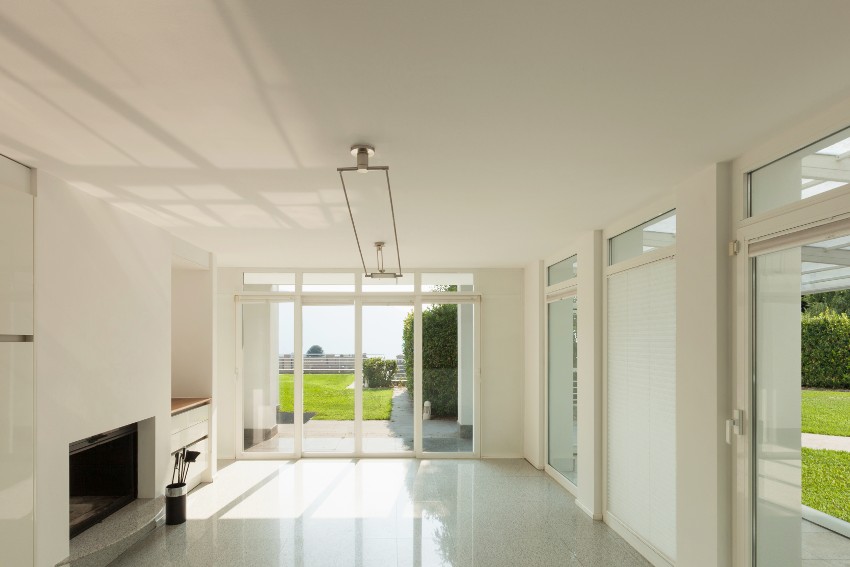 Empty room with glass doors and window with a beautiful grass view