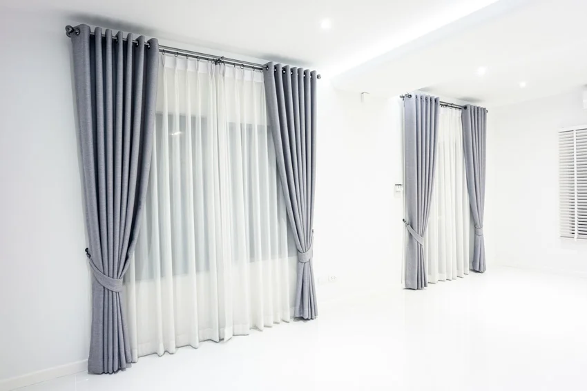 Grey grommet curtains with sheer lining