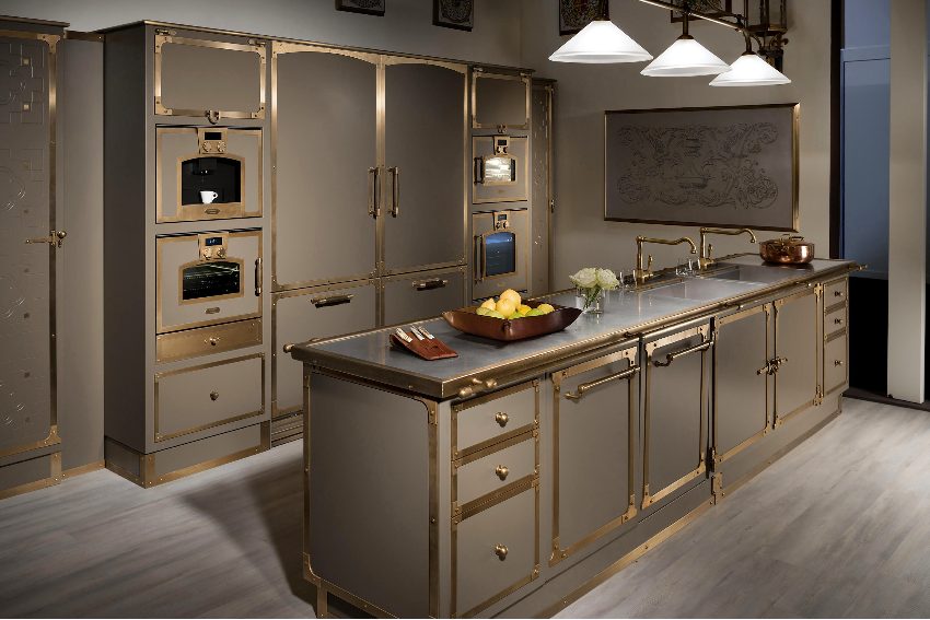 Gorgeous kitchen design with gray and brass inset kitchen cabinets and counters