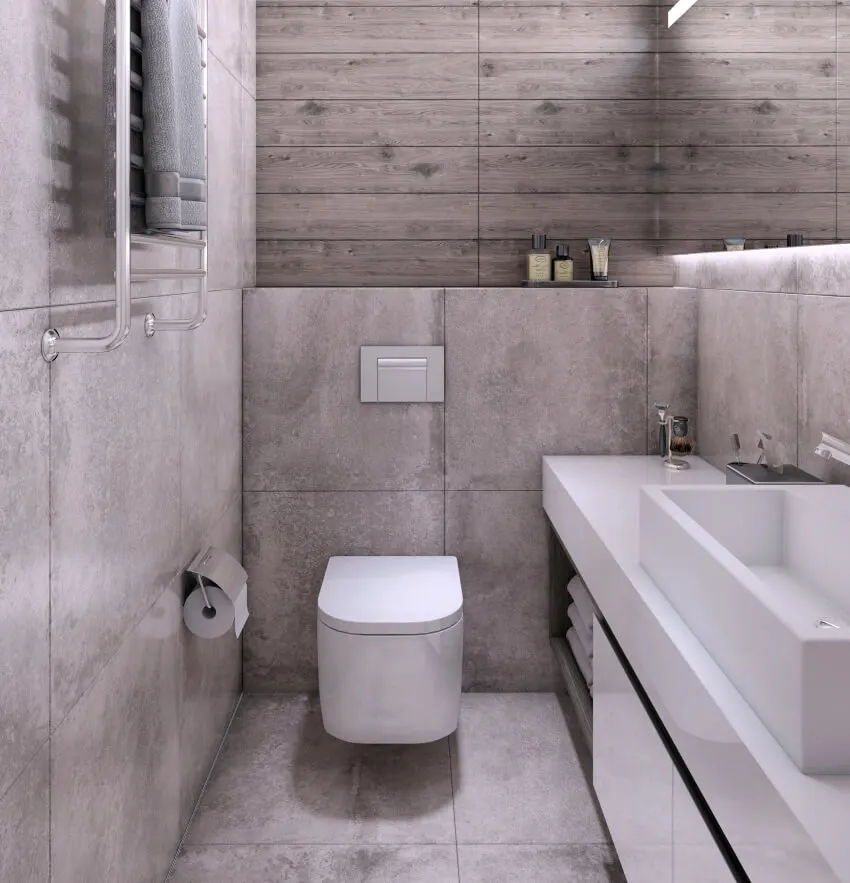 A gray small bathroom interior features large format tile floors and walls
