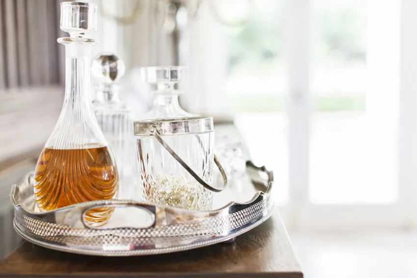 Metal tray with liquor decanter and crystal ice bucket